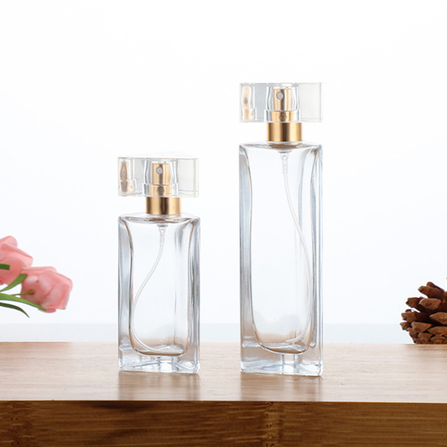 Prisma triangular único de lujo 30 ml 45 ml Botellas de vidrio de perfume vacías con tapa de pulverización de bomba y caja personalizable