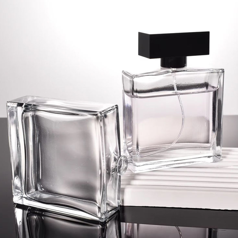 Botella de perfume de vidrio transparente cuadrada plana de alta gama elegante de 50 ml y 100 ml 