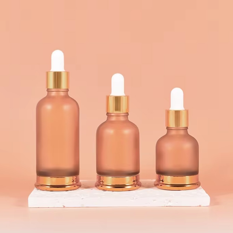 Botella de aceite esencial de vidrio con fondo dorado euro de 25 ml, 35 ml y 50 ml con tapa dorada