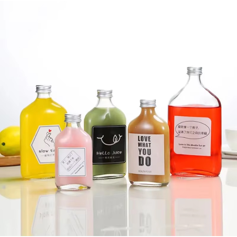 Logotipo personalizado de alta calidad 50ml 200ml 350ml 500ml Botella de vidrio vacía para café Botella de bebida a granel