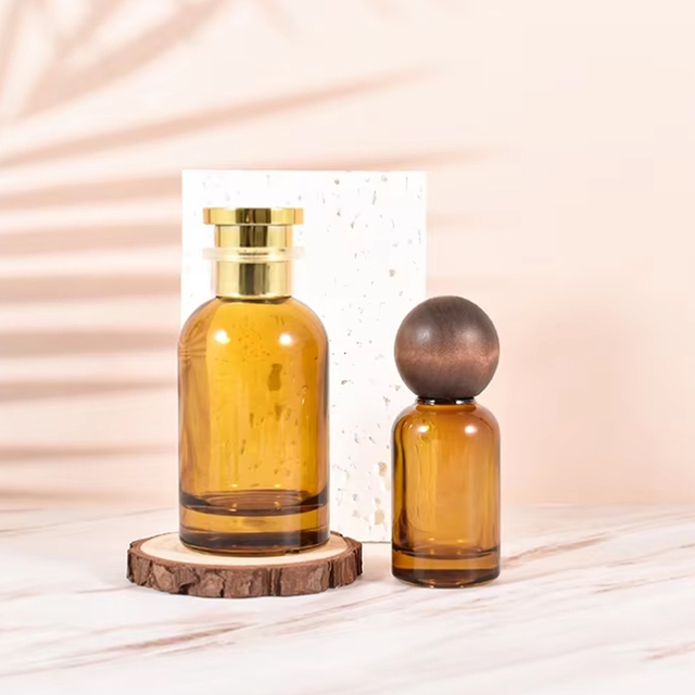 Botellas de perfume de cristal vacías redondas ámbar de encargo al por mayor del logotipo 30ml 50ml 100ml con el casquillo de madera