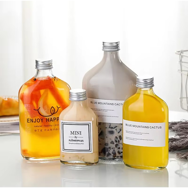 Logotipo personalizado de alta calidad 50ml 200ml 350ml 500ml Botella de vidrio vacía para café Botella de bebida a granel